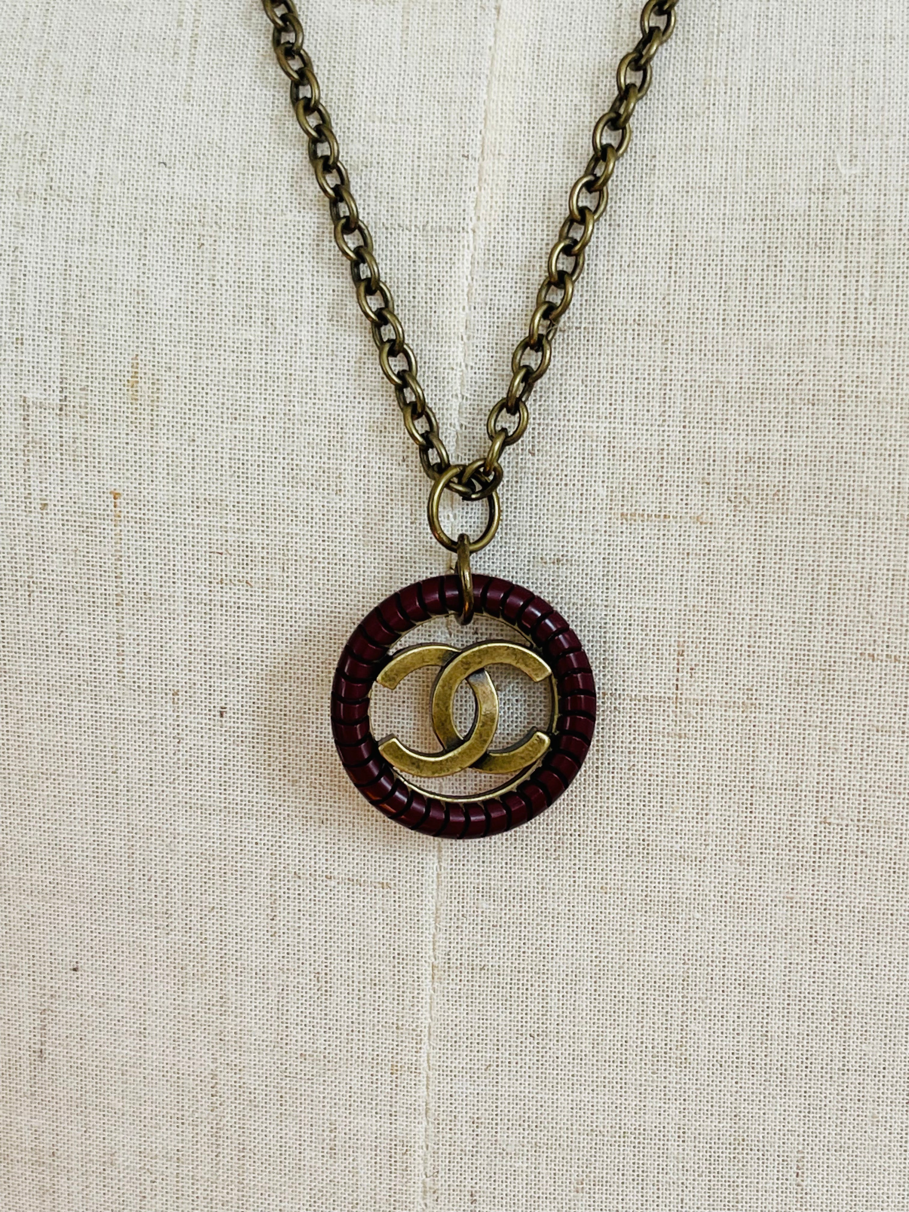 Authentic Chanel Leather & Brass Charm on Pendant Necklace